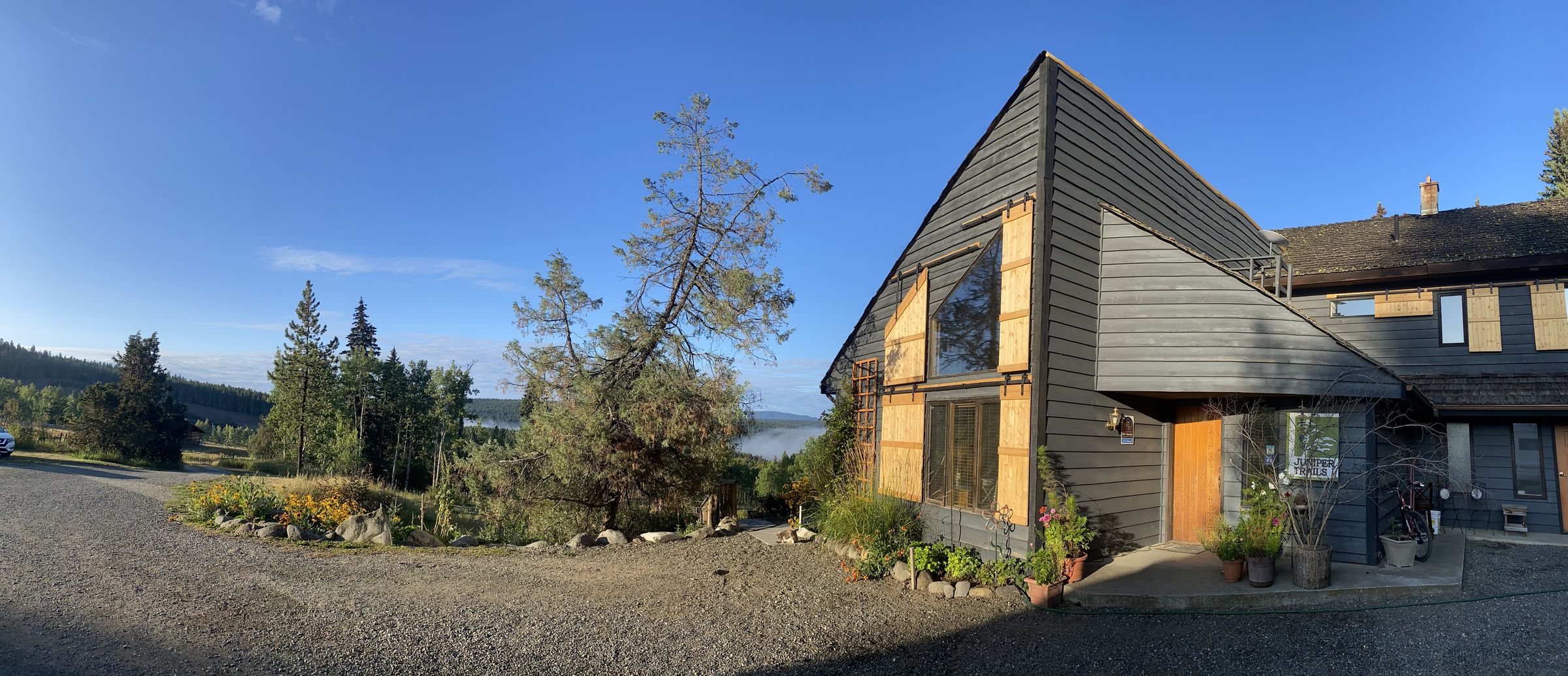 The Juniper Trails house and grounds on a clear Cariboo morning